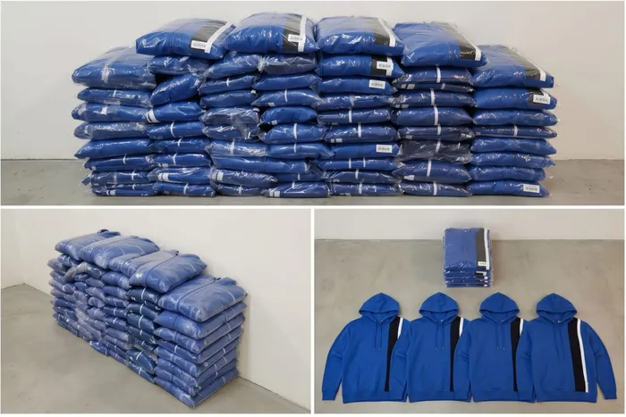 Stacks of poly-bagged finished garments palletised and ready for shipping.