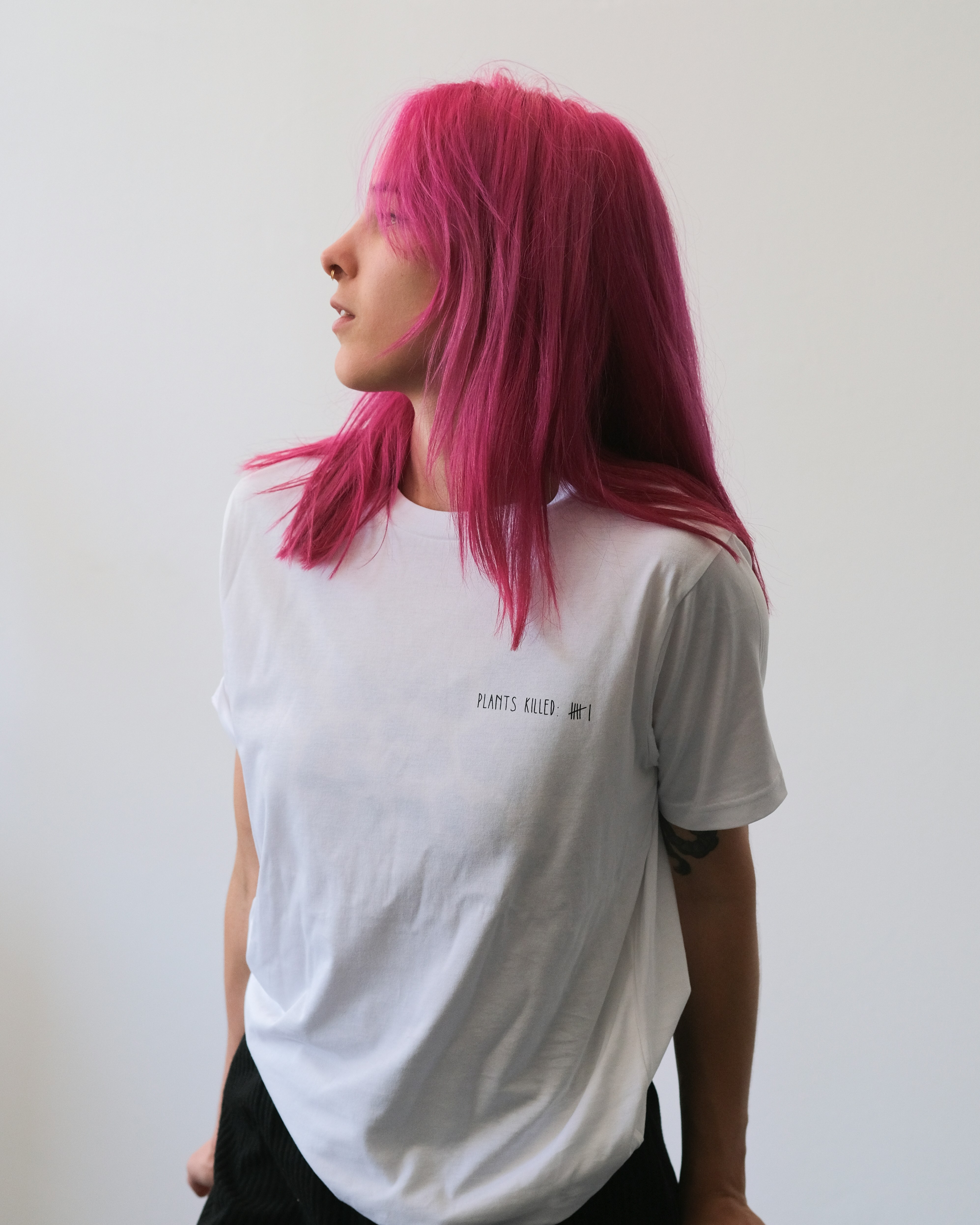 Folded plain t-shirts in a stack.
