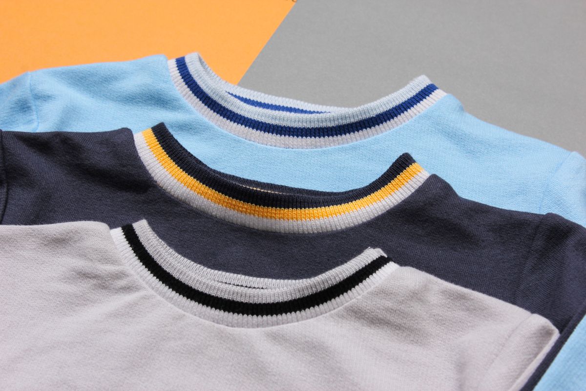 A person wearing a plain heavyweight crewneck sweatshirt.